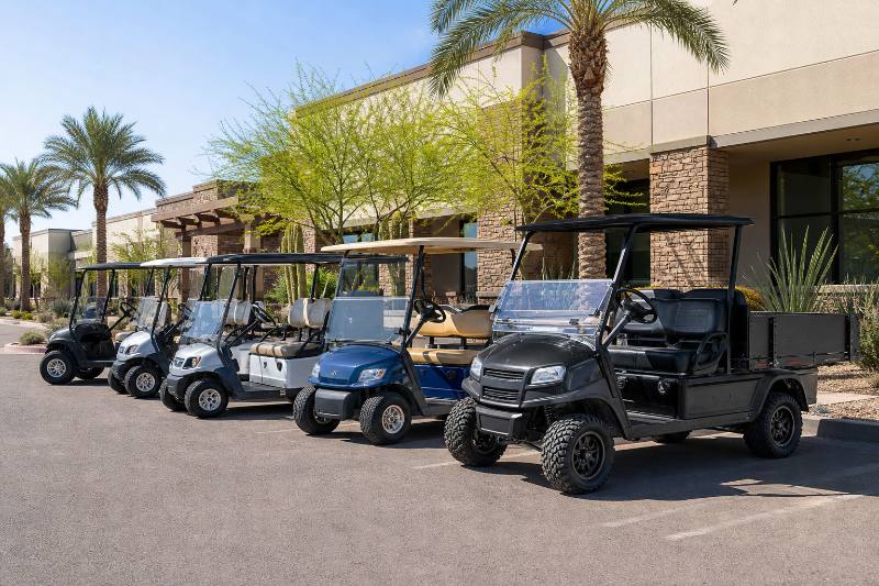 A close-up shot of an advanced commercial golf cart dashboard or utility bed, highlighting specific features important for Phoenix's climate or business operations, with Phoenix landmarks subtly in the background, Commercial Golf Carts Phoenix.
