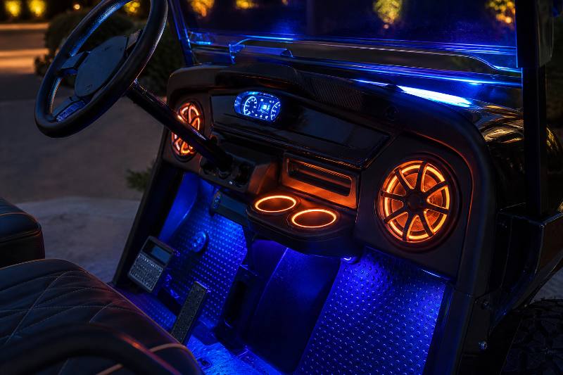 Close-up detail of high-performance Custom Golf Cart Headlights and Taillights in action, showing bright, clear illumination on a golf course or street scene in Phoenix.