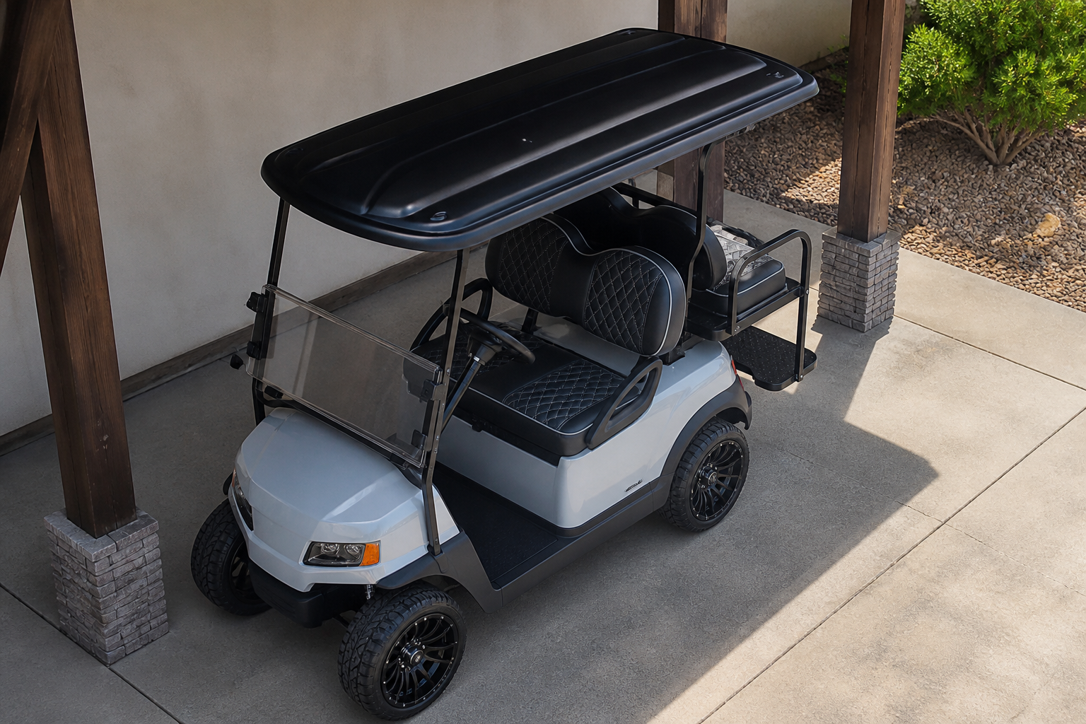 Golf Cart Insurance Phoenix: Various golf carts, including 2-passenger, 4-passenger, and utility models, lined up at a PHOENIX GOLF CAR SUPERSTORE facility for rental or service, showcasing diverse inventory and maintenance.